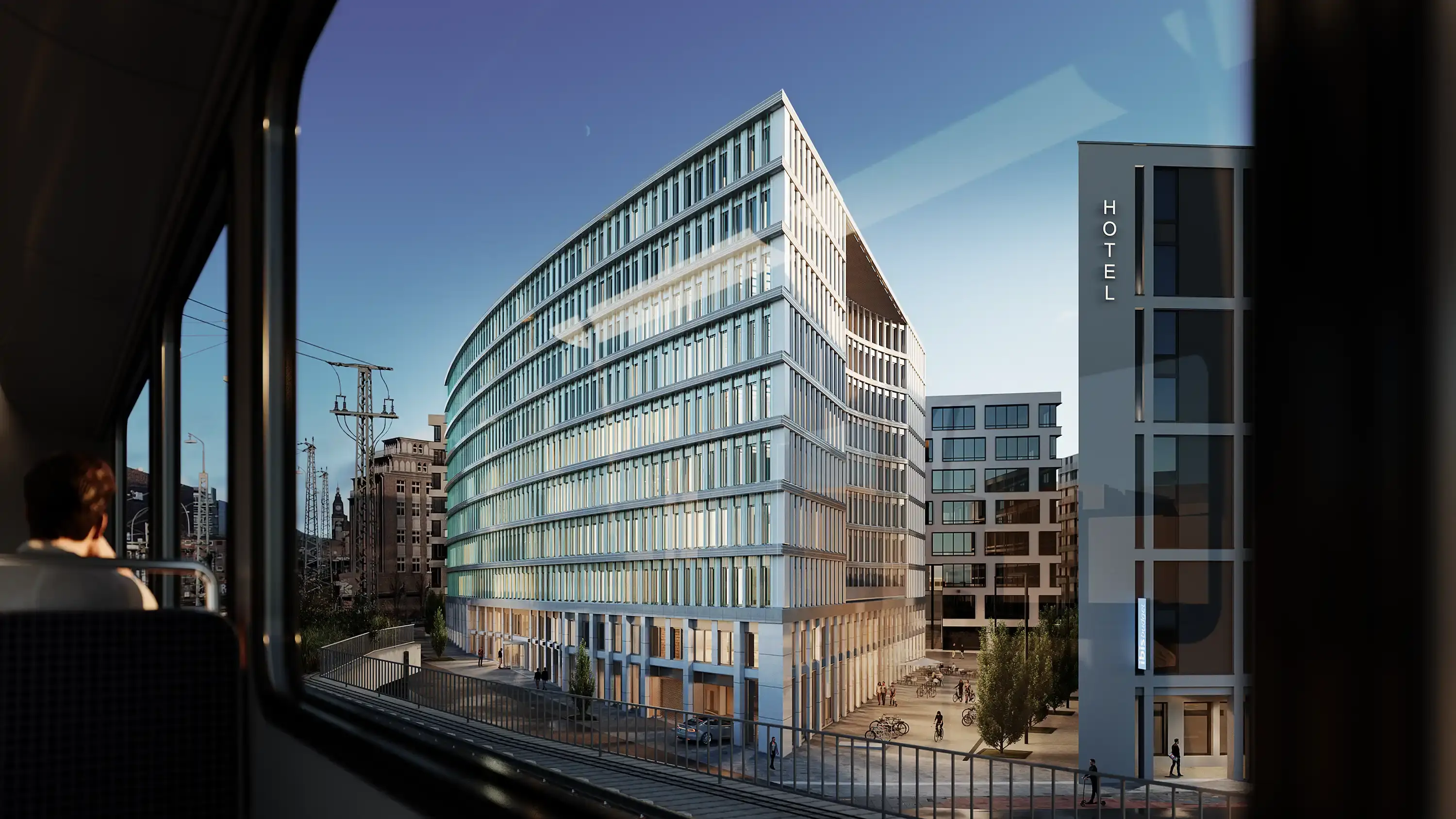 Neubau Connexion mit gerundeter Glasfassade, gesehen aus dem Fenster einer Bahn