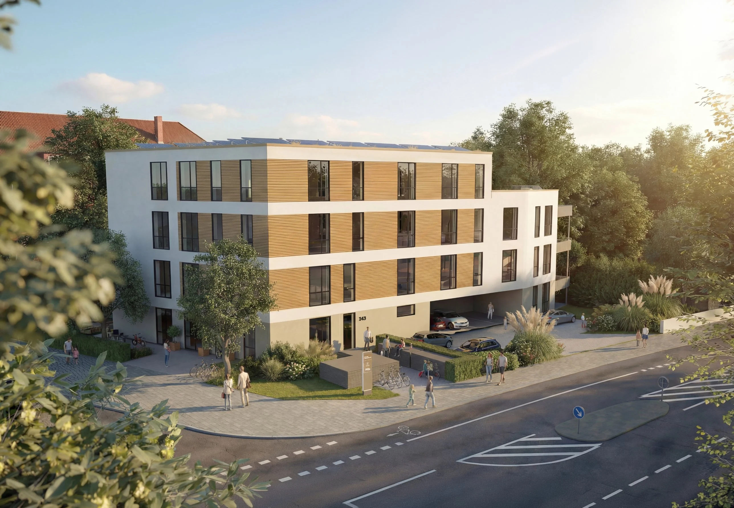 Sozialimmobilie mit Holzfassade an einer Straßenecke im Abendlicht