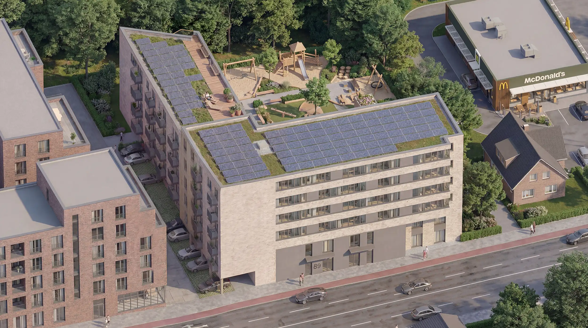 Luftbild mit Solaranlage, Dachterrasse und Spielplatz auf dem Dach