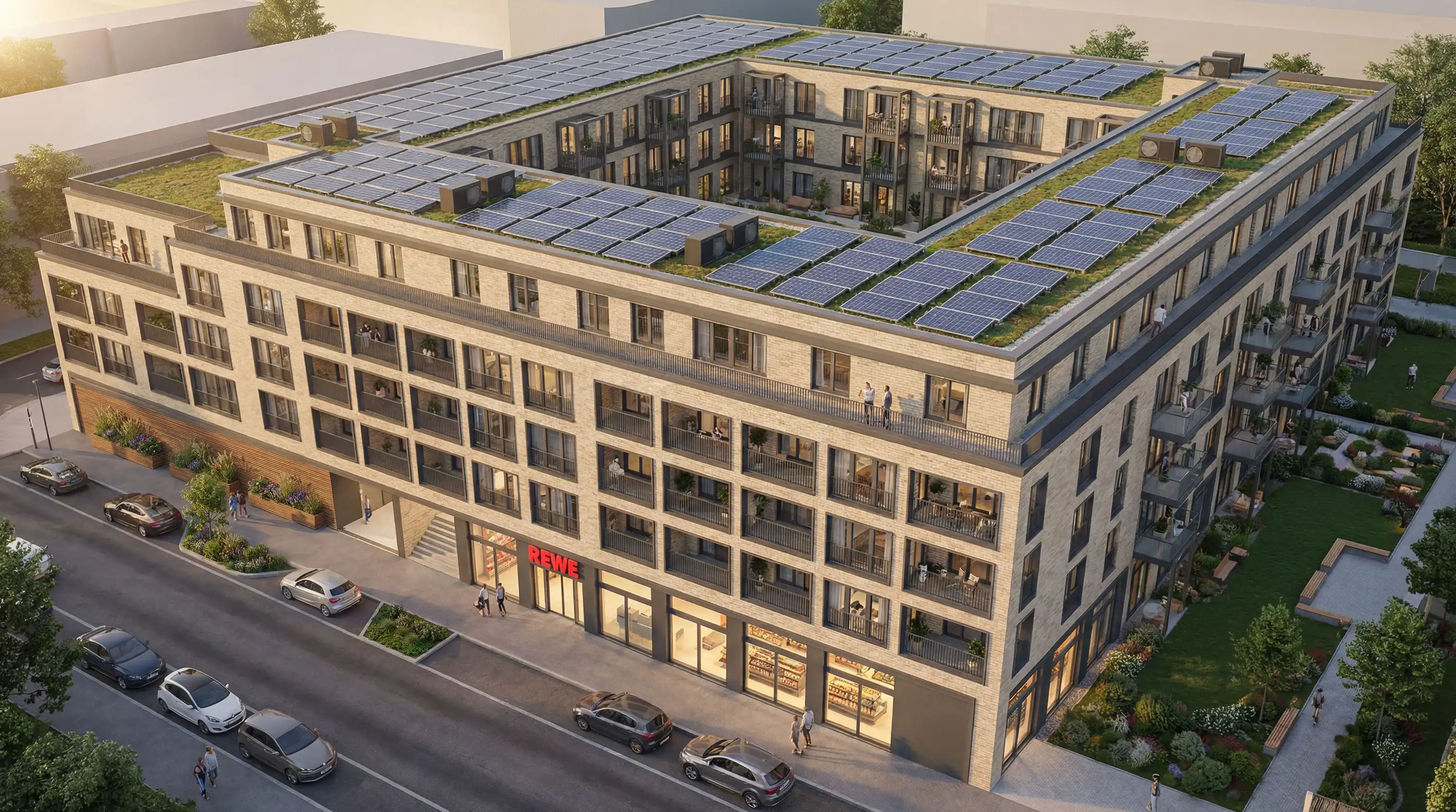 Luftbild des Wohnblocks mit Solardach, Innenhof und Supermarkt im Erdgeschoss